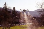 Spraying of preparations using a drone